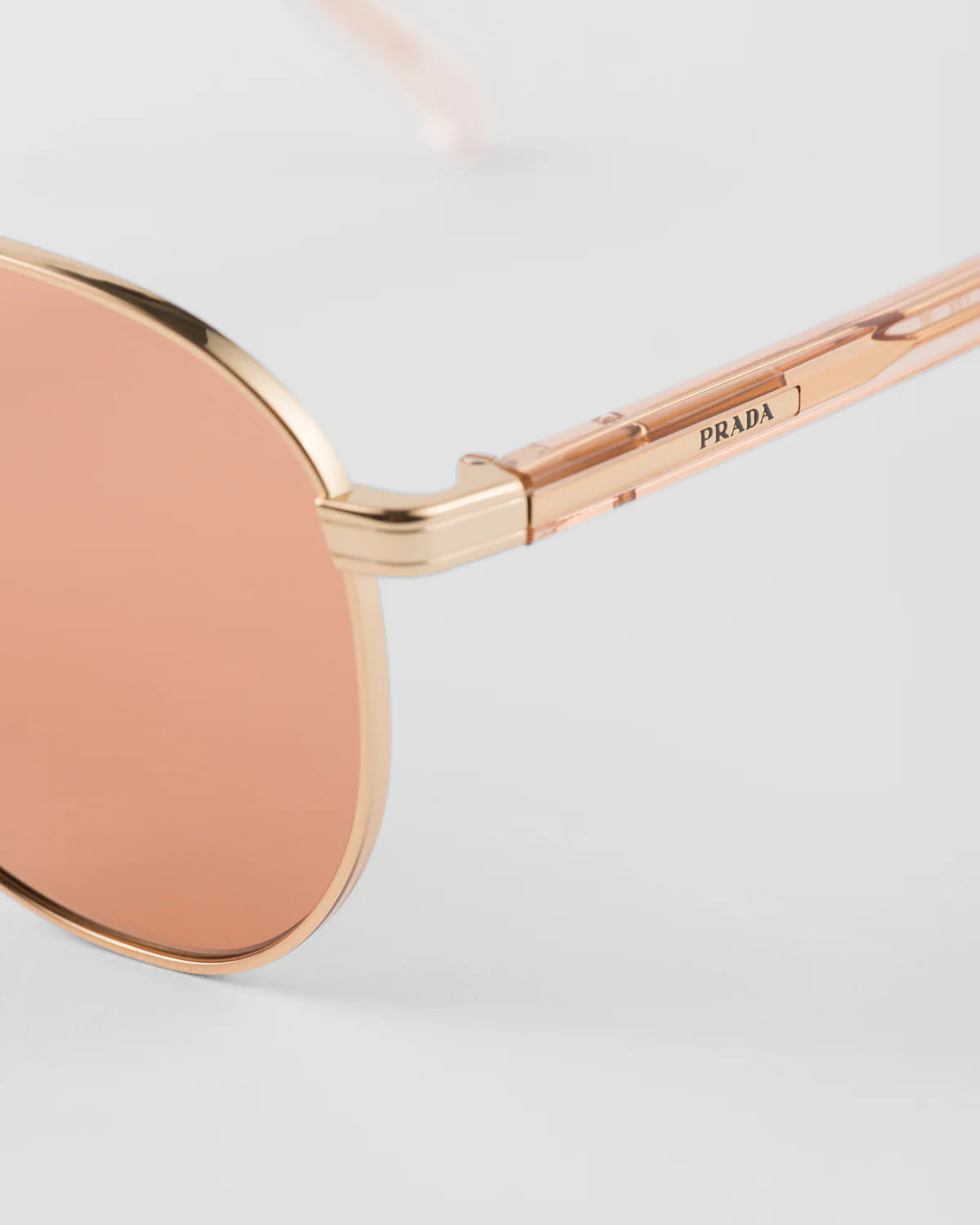LUNETTES  DE SOLEIL ORNÉES DU LOGO PRADA
VERRES TERRACOTTA